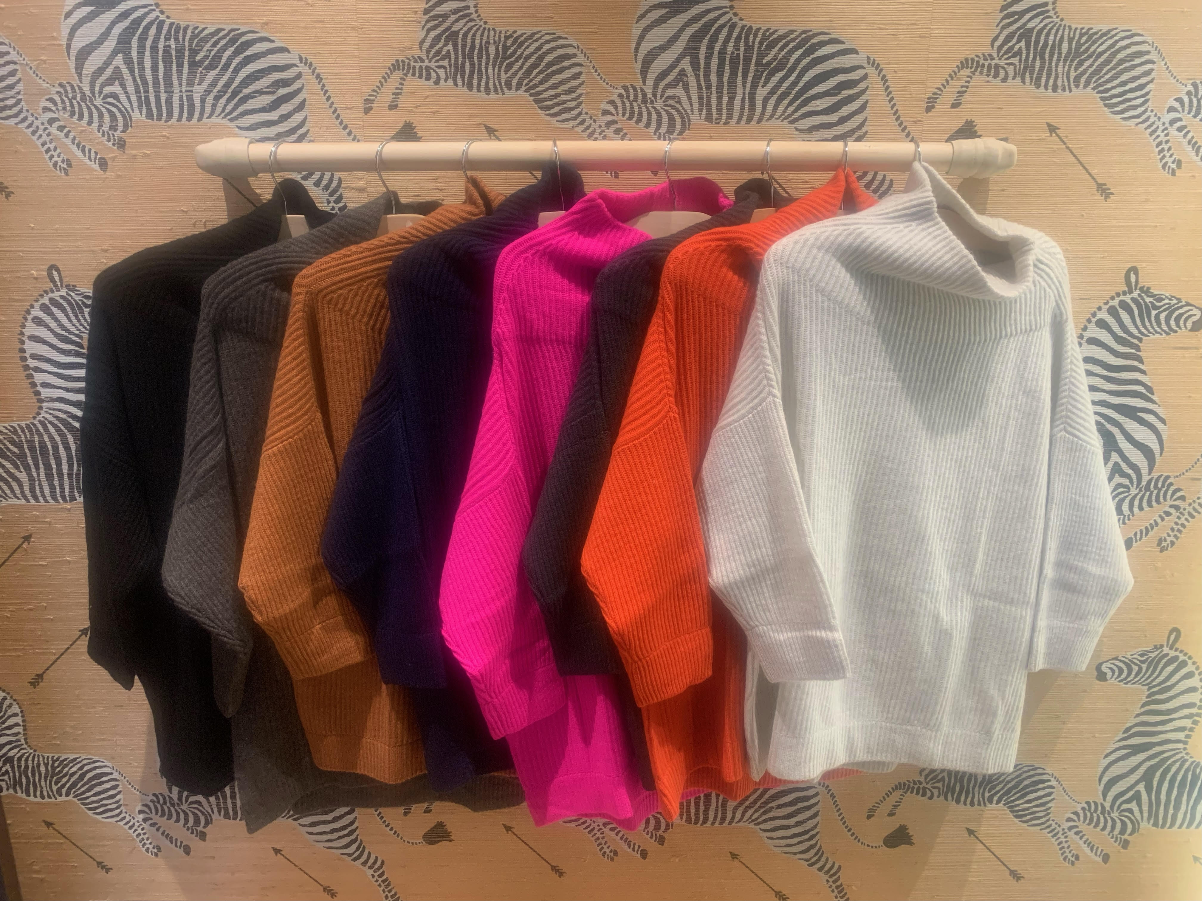 In order from LEFT: Black, umber, spice, navy, atomic pink, kale. koi, mojave